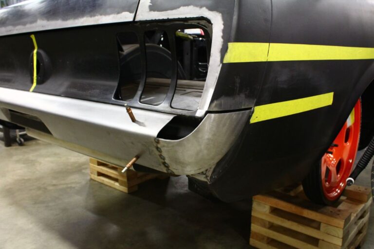 Custom 1969 Fastback Mustang with supercharged coyote engine rear bumper fabrication