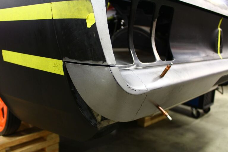 Custom 1969 Fastback Mustang with supercharged coyote engine rear bumper fabrication