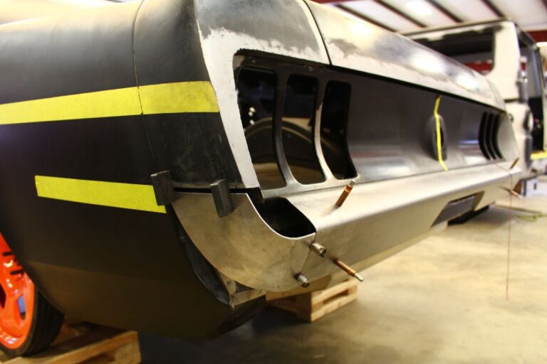 Custom 1969 Fastback Mustang with supercharged coyote engine rear bumper fabrication